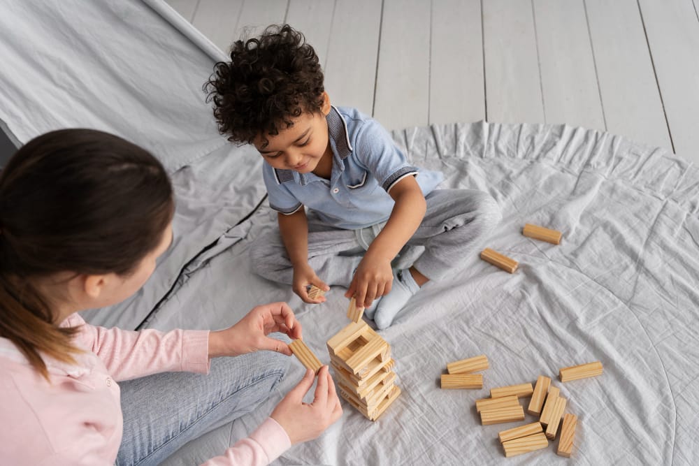 foster carer playing with child
